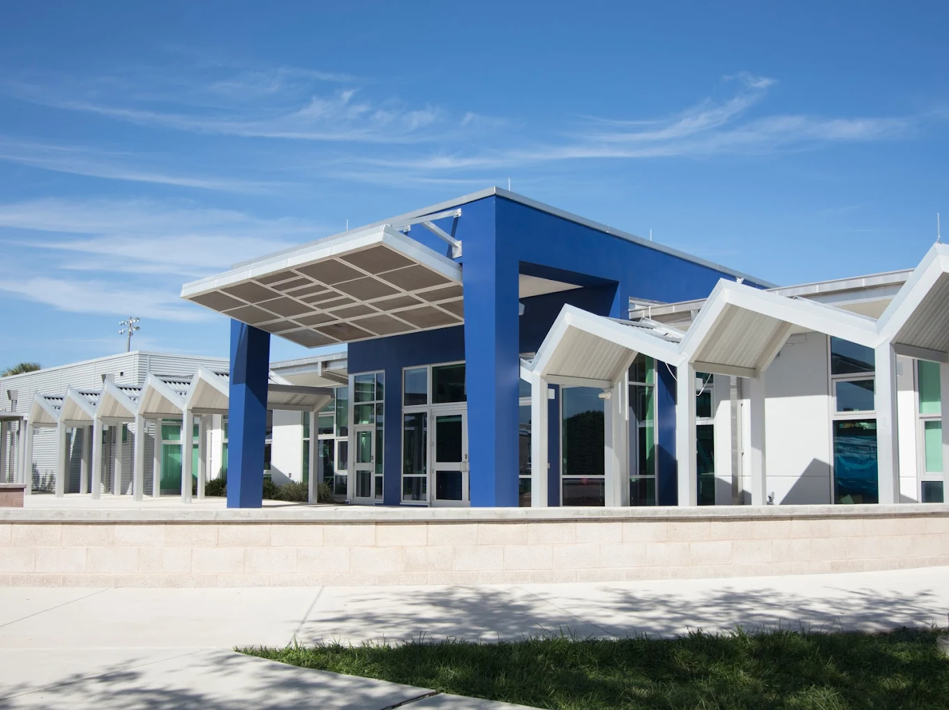 FAU High School entrance with modern white canopy and glass architecture